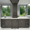 Dark Grey kitchen cabinets with a full-height window wall and white countertops