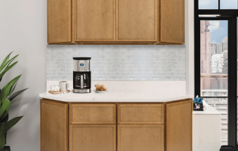 Mini Shaker Cappuccino kitchen cabinets on an angled peninsula with matching wall cabinets