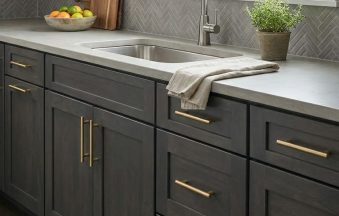 Dark Grey kitchen cabinets by CCC Cabinets shown in a sink run beneath a bright window - flat shaker door in a deep charcoal stain, wholesale cabinetry in Des Plaines, Chicagoland